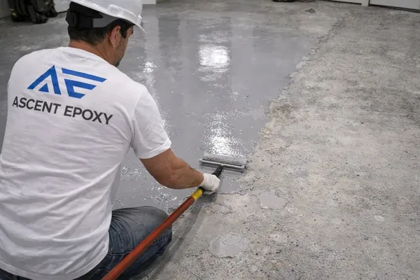 Applying repair coating over restored concrete