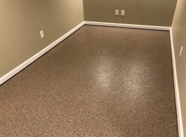 Basement epoxy floor with tan flake finish