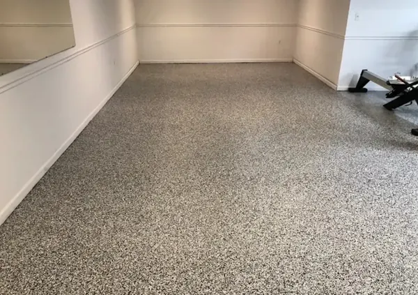 Basement home gym with gray flake epoxy floor