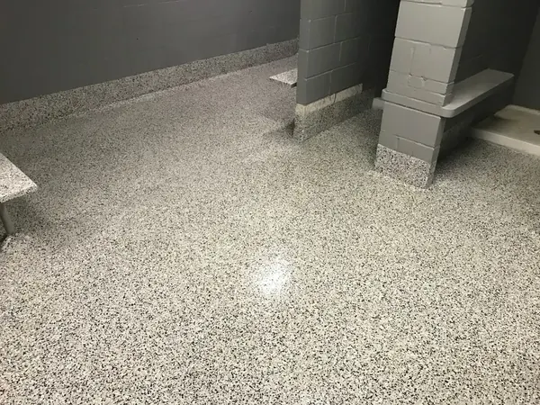Commercial flake floor coating with coated curb